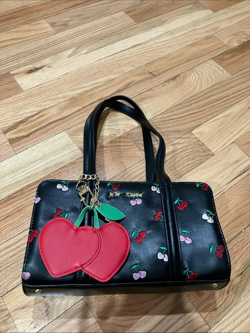 Betsy Johnsonโs Women's Black Cherry- embroidered satchel with Red Cherry Charm